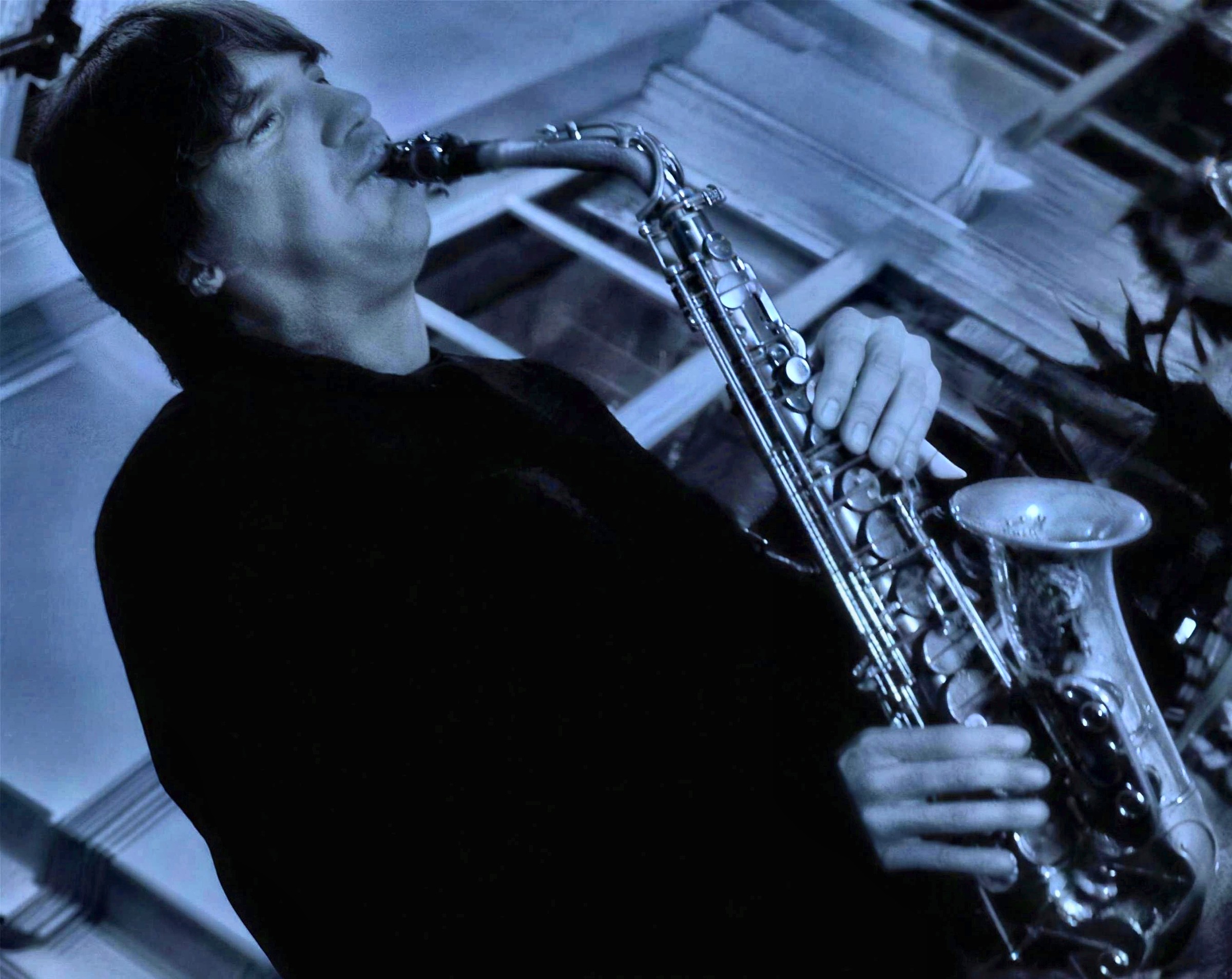A blur of guitar and saxophone
