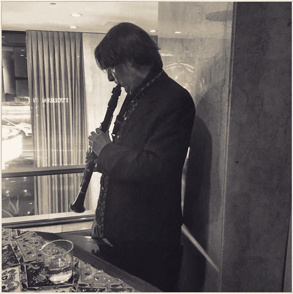 Clarinet by the hotel window, after the set